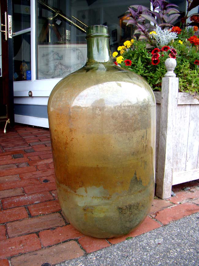 A large hand blown demi-john French Pommard Wine Bottle circa 1850